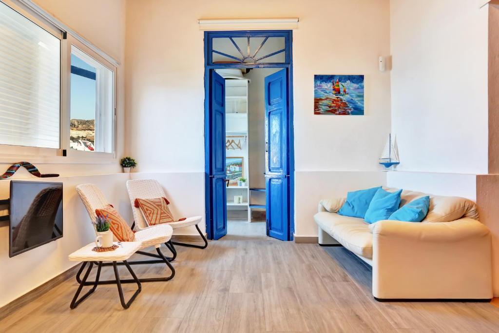 La Casa del Capitán - living-room-blue-door-sofa-tv